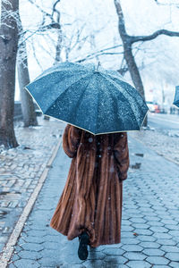 Wet umbrella on street during rainy season