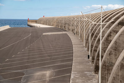 Bridge over sea against sky