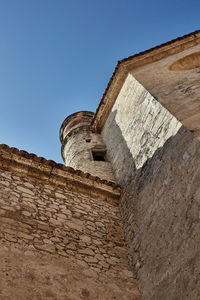 Low angle view of fort against blue sky