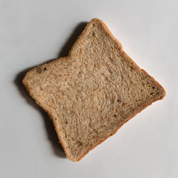 High angle view of bread against white background