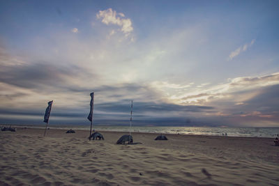 Scenic view of beach against sky during sunset