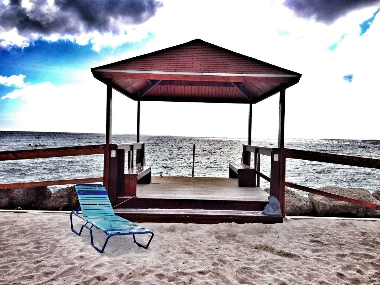 sea, beach, sand, sky, absence, water, chair, horizon over water, empty, shore, tranquil scene, tranquility, scenics, deck chair, lounge chair, relaxation, beach umbrella, parasol, nature, vacations