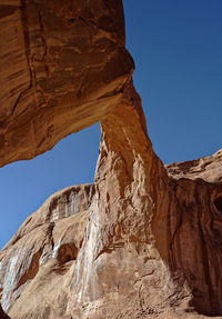 Low angle view of rock formation against clear sky