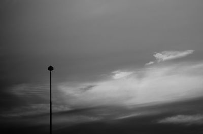 Low angle view of floodlight against sky