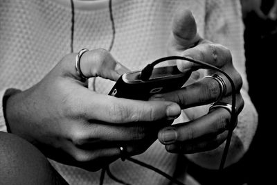 Close-up of hands text messaging