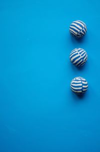High angle view of balls on blue background