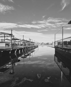 Boats in water against sky