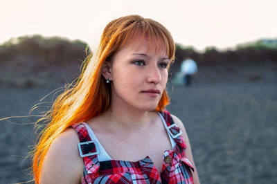 Woman looking away at beach