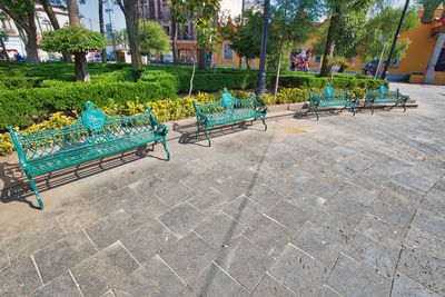 Empty chairs in park