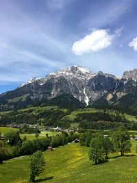 Scenic view of landscape against cloudy sky