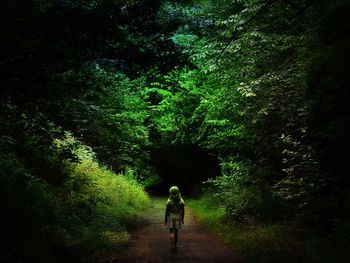 Full length of woman walking on footpath