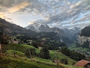 Scenic view of landscape and mountains against sky