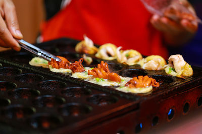 Close-up of person preparing food