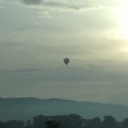 Scenic view of landscape against cloudy sky