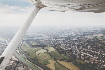 Aerial view of cityscape against sky