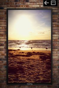Scenic view of beach against sky during sunset