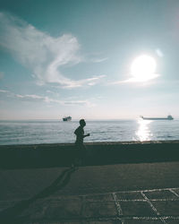 Man jogging by sea