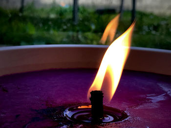 Close-up of lit tea light candle