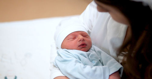 Close-up of a baby girl with eyes closed