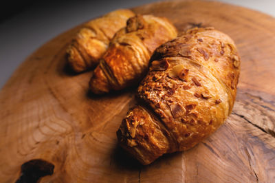 Close up of a bunch of delicious croissants on a dark background. homemade croissants.