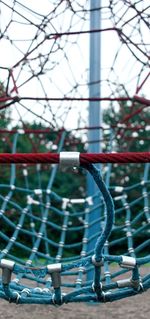 Close-up of metal fence at playground