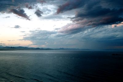 Scenic view of sea against storm clouds