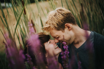 Young couple on purple outdoors