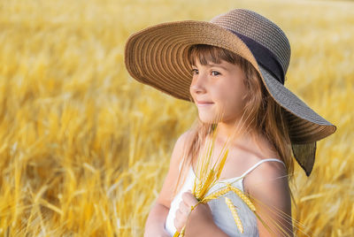 Portrait of young woman wearing hat