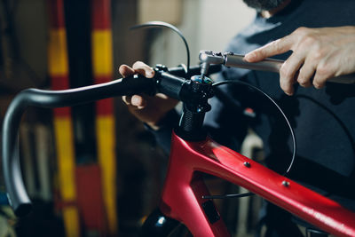 Cropped image of man riding bicycle