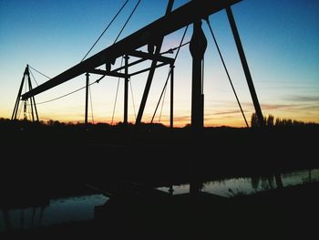 Silhouette of power lines at sunset