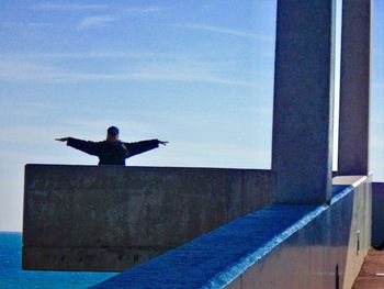 Man and woman against sky