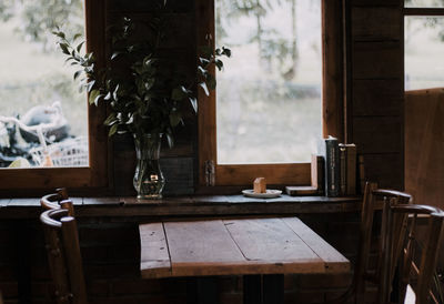 Chairs and table by window at home