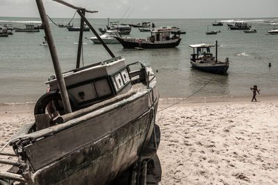 Boats moored at harbor