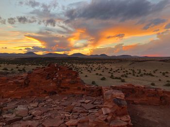 Scenic view of landscape against sky during sunset