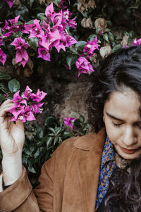 Close-up of woman with pink flowers