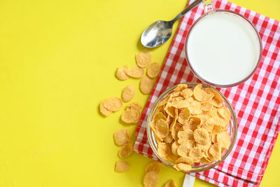 Directly above shot of food on yellow background