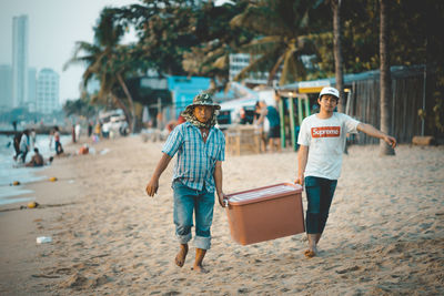 Full length of boys on beach