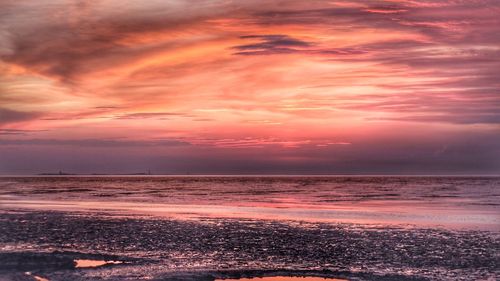 Scenic view of sea against sky during sunset