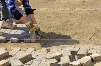 Low section of man working at construction site