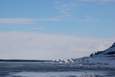 Scenic view of sea against sky during winter