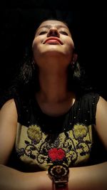 Portrait of young woman looking up