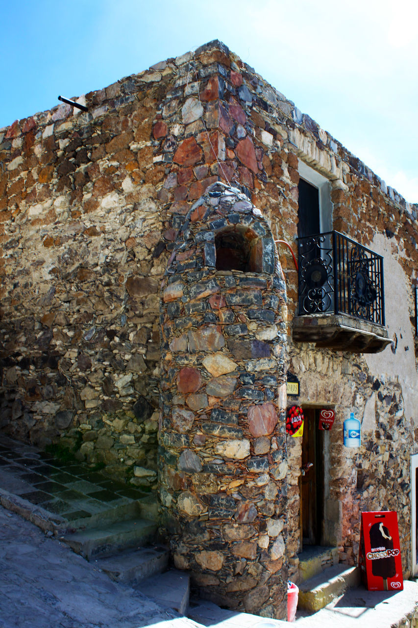 OLD WEATHERED BUILDING AGAINST SKY