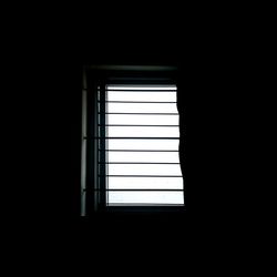 Low angle view of window in darkroom