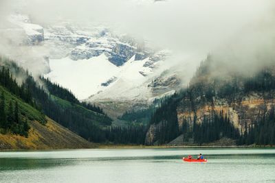 Scenic view of river and mountains