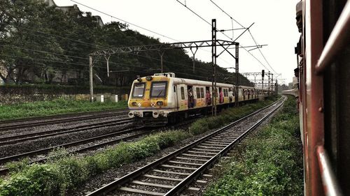 Train on railroad track against sky