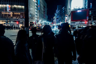 People in city at night