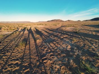 Scenic view of arid landscape against sky