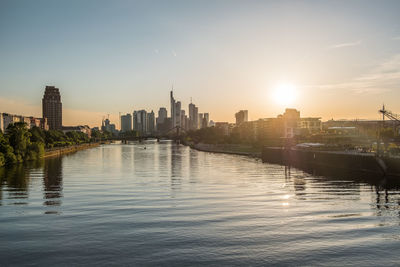 Buildings in city at sunset