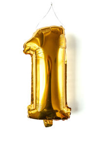 Close-up of yellow bell tower against white background