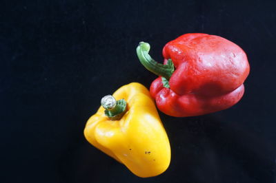 High angle view of fruits on table against black background